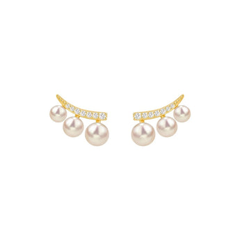 A curved arc of 18K gold stud — pavé-set with sparkling natural zircons — cradles three graduating Japanese freshwater pearl