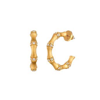hoop rendered in brushed 18K gold or white gold vermeil, with sparkling natural zircons set at every joint
