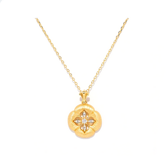 textured gold floral pendant with diamond accents
